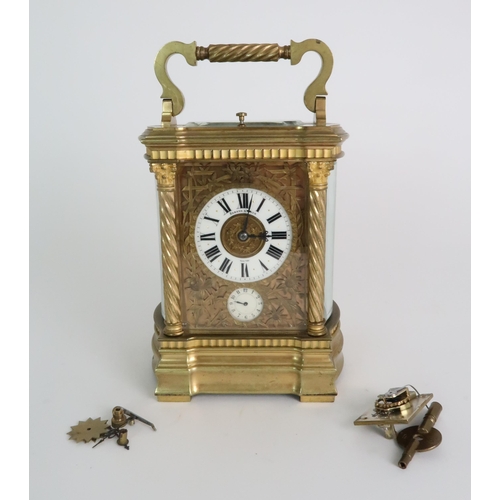 278 - A HARMANN AND KOCH GLASS AND BRASS CARRIAGE ALARM CLOCK