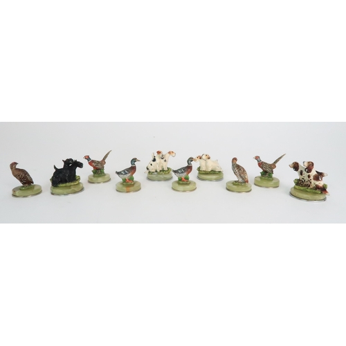 299 - A BOXED SET OF FOUR COLD PAINTED SPELTER DOG NAME HOLDERS