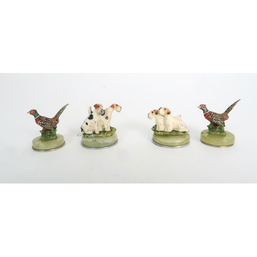 299 - A BOXED SET OF FOUR COLD PAINTED SPELTER DOG NAME HOLDERS