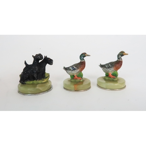 299 - A BOXED SET OF FOUR COLD PAINTED SPELTER DOG NAME HOLDERS