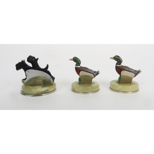 299 - A BOXED SET OF FOUR COLD PAINTED SPELTER DOG NAME HOLDERS