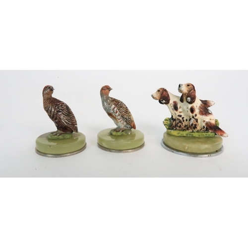 299 - A BOXED SET OF FOUR COLD PAINTED SPELTER DOG NAME HOLDERS