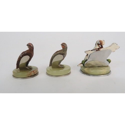 299 - A BOXED SET OF FOUR COLD PAINTED SPELTER DOG NAME HOLDERS