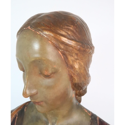 310 - A PAINTED TERRACOTTA BUST OF A WOMAN