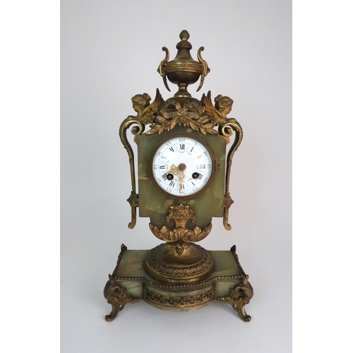 337 - A FRENCH ONYX AND ORMOLU MOUNTED MANTLE CLOCK