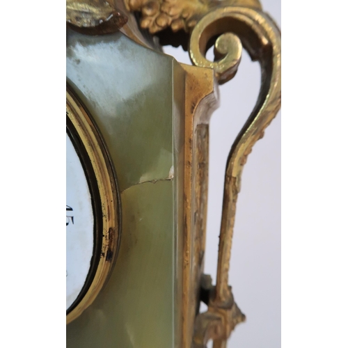 337 - A FRENCH ONYX AND ORMOLU MOUNTED MANTLE CLOCK