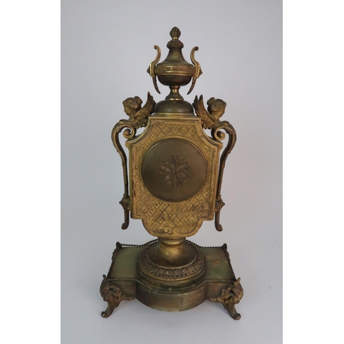 337 - A FRENCH ONYX AND ORMOLU MOUNTED MANTLE CLOCK