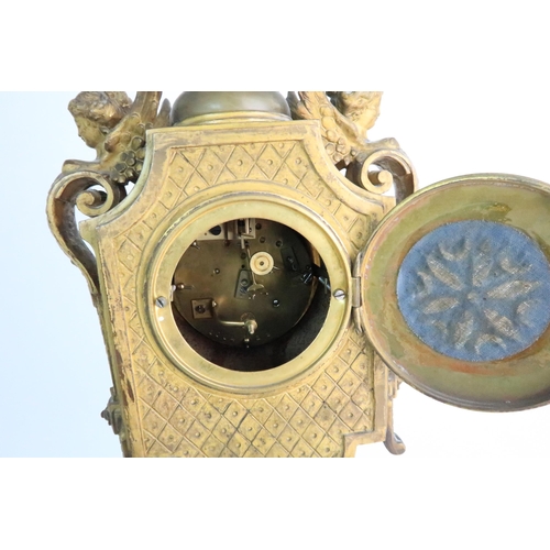 337 - A FRENCH ONYX AND ORMOLU MOUNTED MANTLE CLOCK