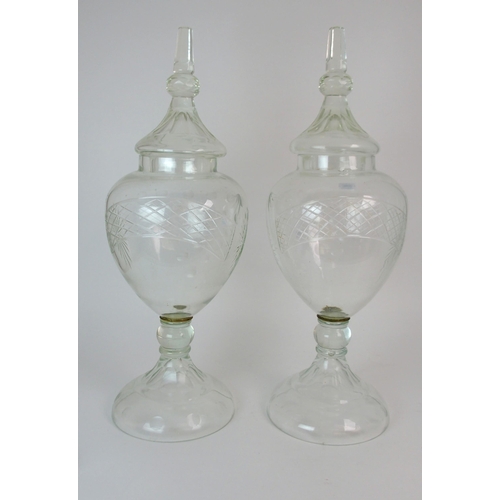 348 - A PAIR OF LARGE CUT GLASS CHEMISTS DISPLAY JARS AND COVERS