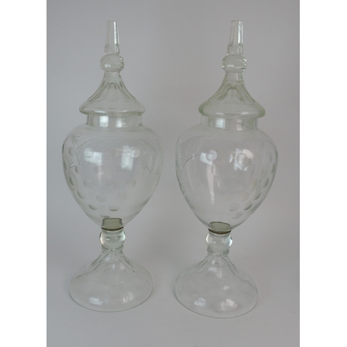 348 - A PAIR OF LARGE CUT GLASS CHEMISTS DISPLAY JARS AND COVERS