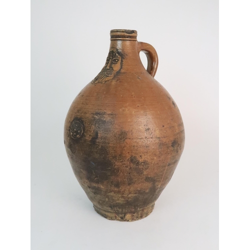 358 - A 17TH CENTURY BELLARMINE STONEWARE JUG