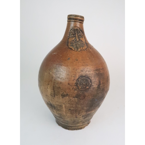 358 - A 17TH CENTURY BELLARMINE STONEWARE JUG