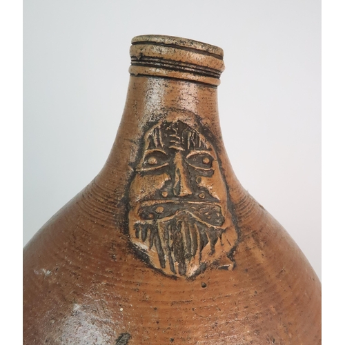 358 - A 17TH CENTURY BELLARMINE STONEWARE JUG