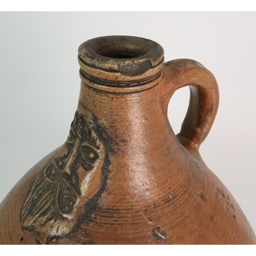 358 - A 17TH CENTURY BELLARMINE STONEWARE JUG