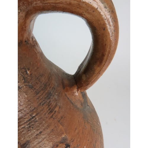 358 - A 17TH CENTURY BELLARMINE STONEWARE JUG