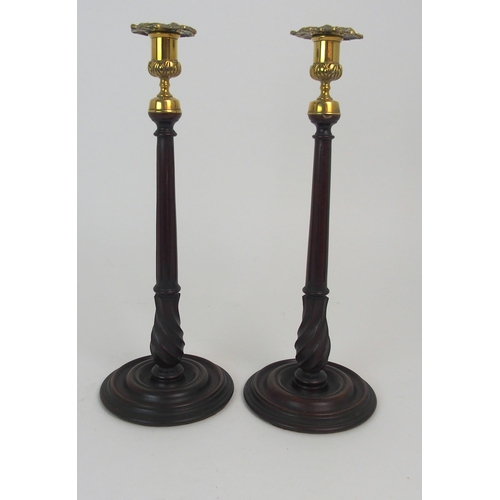 431 - A PAIR OF MAHOGANY AND BRASS MOUNTED CANDLE STICKS