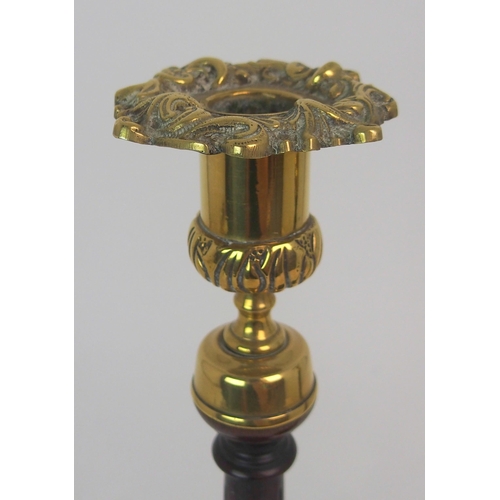 431 - A PAIR OF MAHOGANY AND BRASS MOUNTED CANDLE STICKS