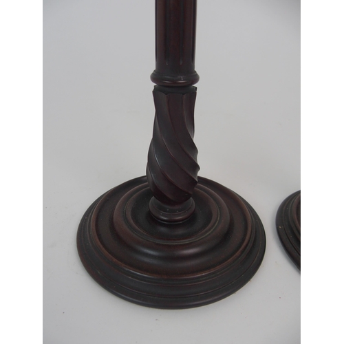 431 - A PAIR OF MAHOGANY AND BRASS MOUNTED CANDLE STICKS