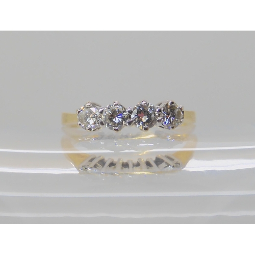 522 - A FOUR STONE DIAMOND RING