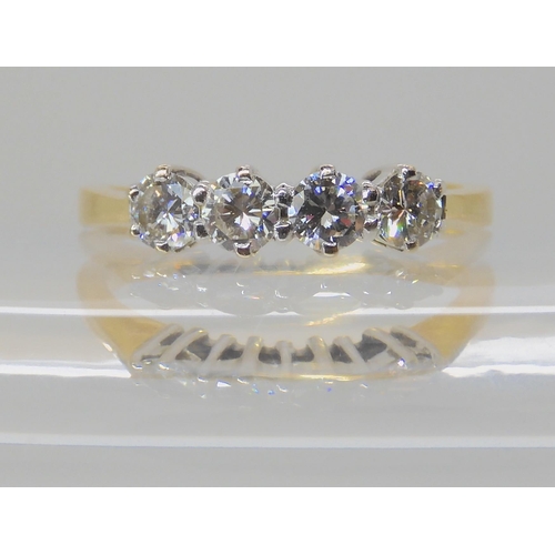 522 - A FOUR STONE DIAMOND RING