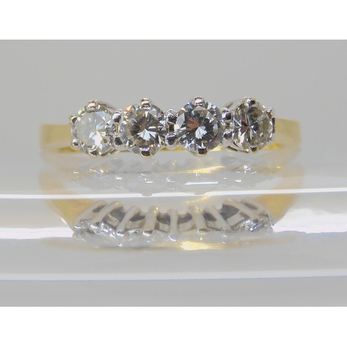 522 - A FOUR STONE DIAMOND RING