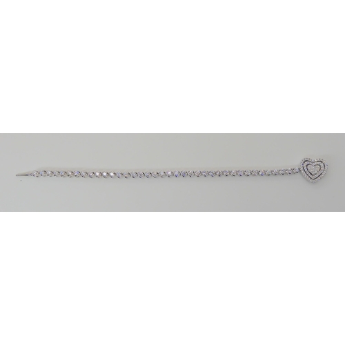 533 - AN 18CT WHITE GOLD DIAMOND TENNIS BRACELET