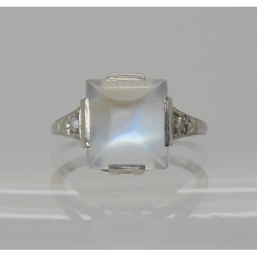 546 - A PLATINUM ART DECO SUGAR LOAF CUT MOONSTONE AND DIAMOND RING