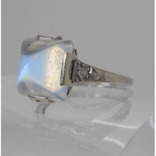 546 - A PLATINUM ART DECO SUGAR LOAF CUT MOONSTONE AND DIAMOND RING