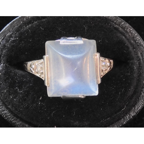 546 - A PLATINUM ART DECO SUGAR LOAF CUT MOONSTONE AND DIAMOND RING