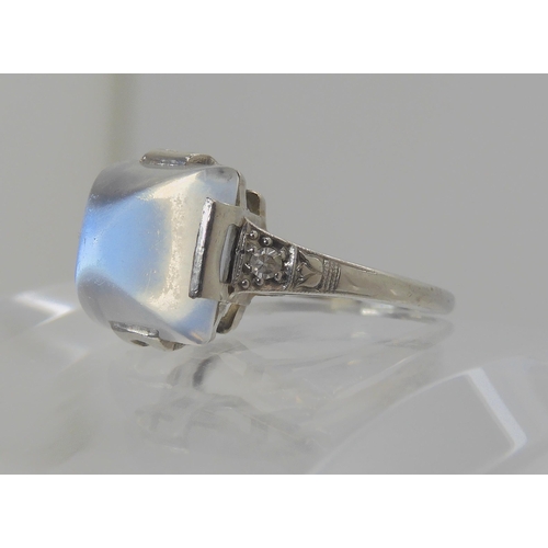 546 - A PLATINUM ART DECO SUGAR LOAF CUT MOONSTONE AND DIAMOND RING