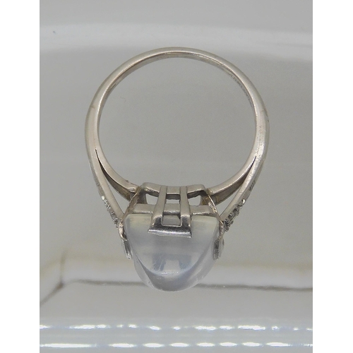 546 - A PLATINUM ART DECO SUGAR LOAF CUT MOONSTONE AND DIAMOND RING