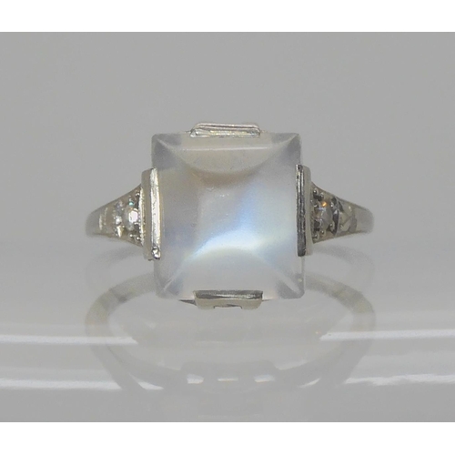 546 - A PLATINUM ART DECO SUGAR LOAF CUT MOONSTONE AND DIAMOND RING