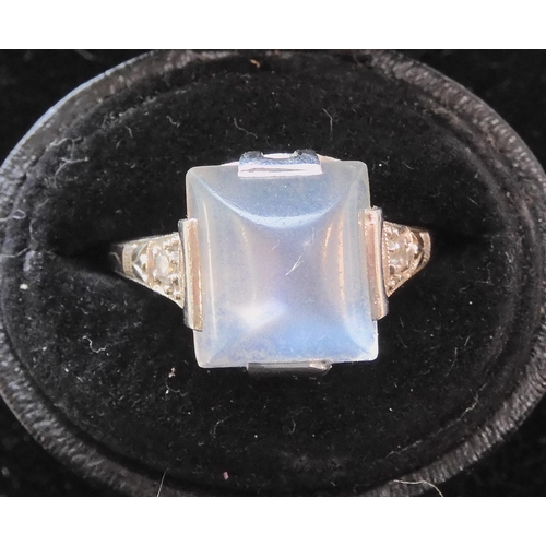 546 - A PLATINUM ART DECO SUGAR LOAF CUT MOONSTONE AND DIAMOND RING