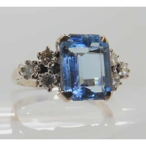 547 - AN 18CT WHITE GOLD AQUAMARINE AND DIAMOND RING