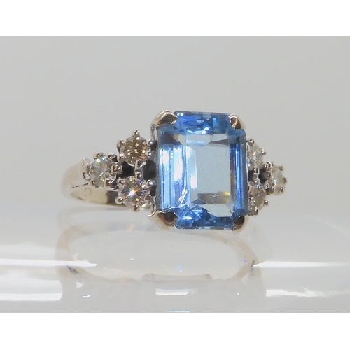 547 - AN 18CT WHITE GOLD AQUAMARINE AND DIAMOND RING