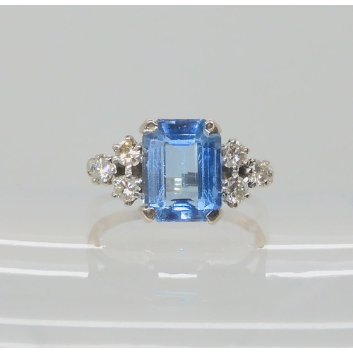 547 - AN 18CT WHITE GOLD AQUAMARINE AND DIAMOND RING