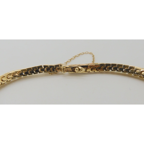 548 - A 14K YELLOW GOLD DIAMOND TENNIS BRACELET