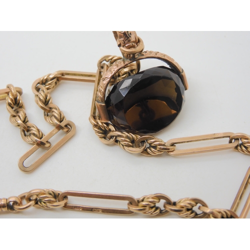 559 - A 9CT ROSE GOLD FANCY FOB CHAIN & SEAL