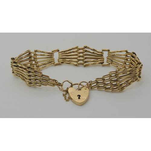 563 - A 9CT GOLD FANCY GATE BRACELET