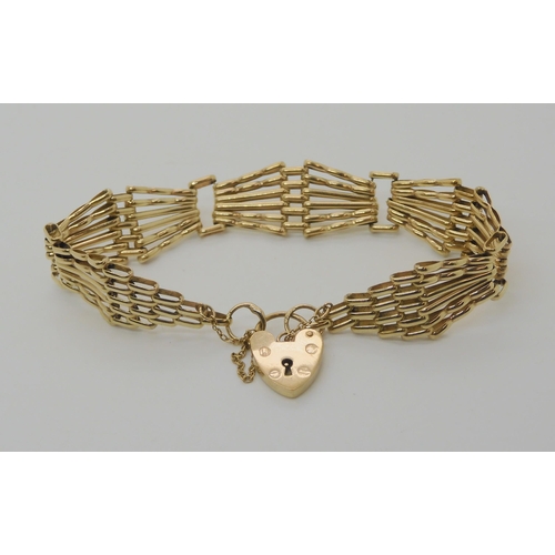 563 - A 9CT GOLD FANCY GATE BRACELET