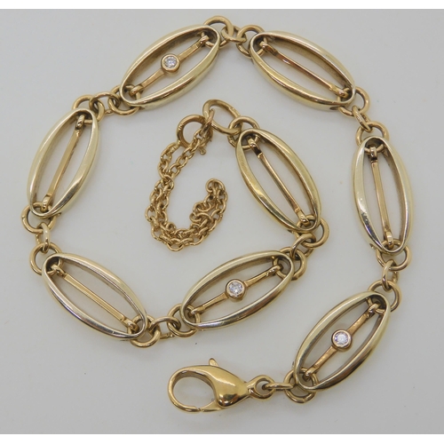 564 - A 9CT GOLD DIAMOND SET FANCY LINK BRACELET