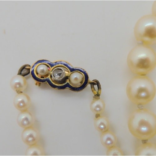 566 - TWO STRINGS OF PEARLS WITH DECORATIVE CLASPS