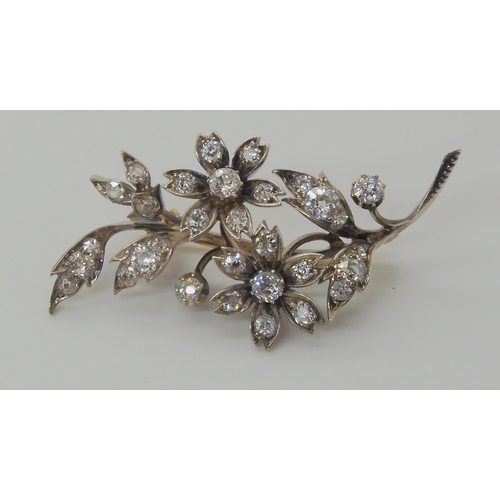 575 - A DIAMOND FLOWER BROOCH