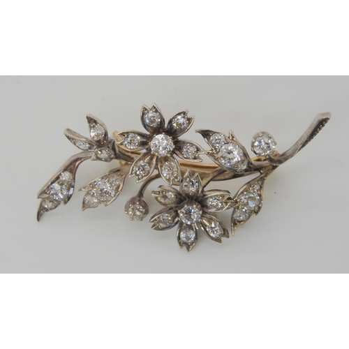 575 - A DIAMOND FLOWER BROOCH