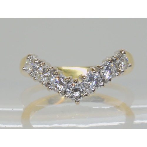 579 - AN 18CT GOLD 'V' SHAPED DIAMOND RING