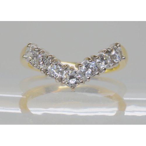 579 - AN 18CT GOLD 'V' SHAPED DIAMOND RING