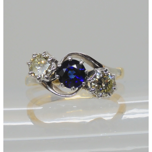 582 - A SAPPHIRE AND OLD CUT DIAMOND THREE STONE RING