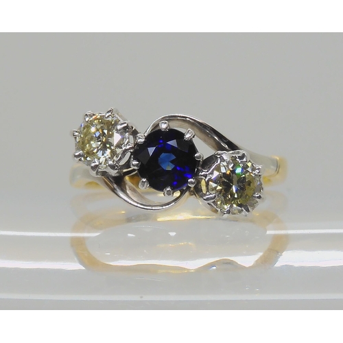 582 - A SAPPHIRE AND OLD CUT DIAMOND THREE STONE RING