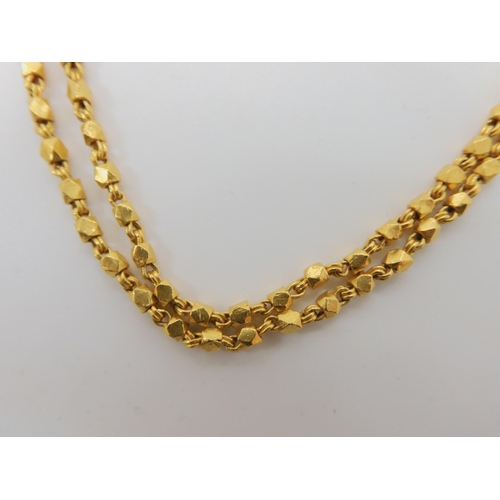 592 - A BRIGHT YELLOW METAL DOUBLE STRAND BEADED NECKLACE