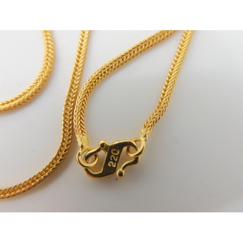 595 - TWO INDIAN GOLD CHAINS